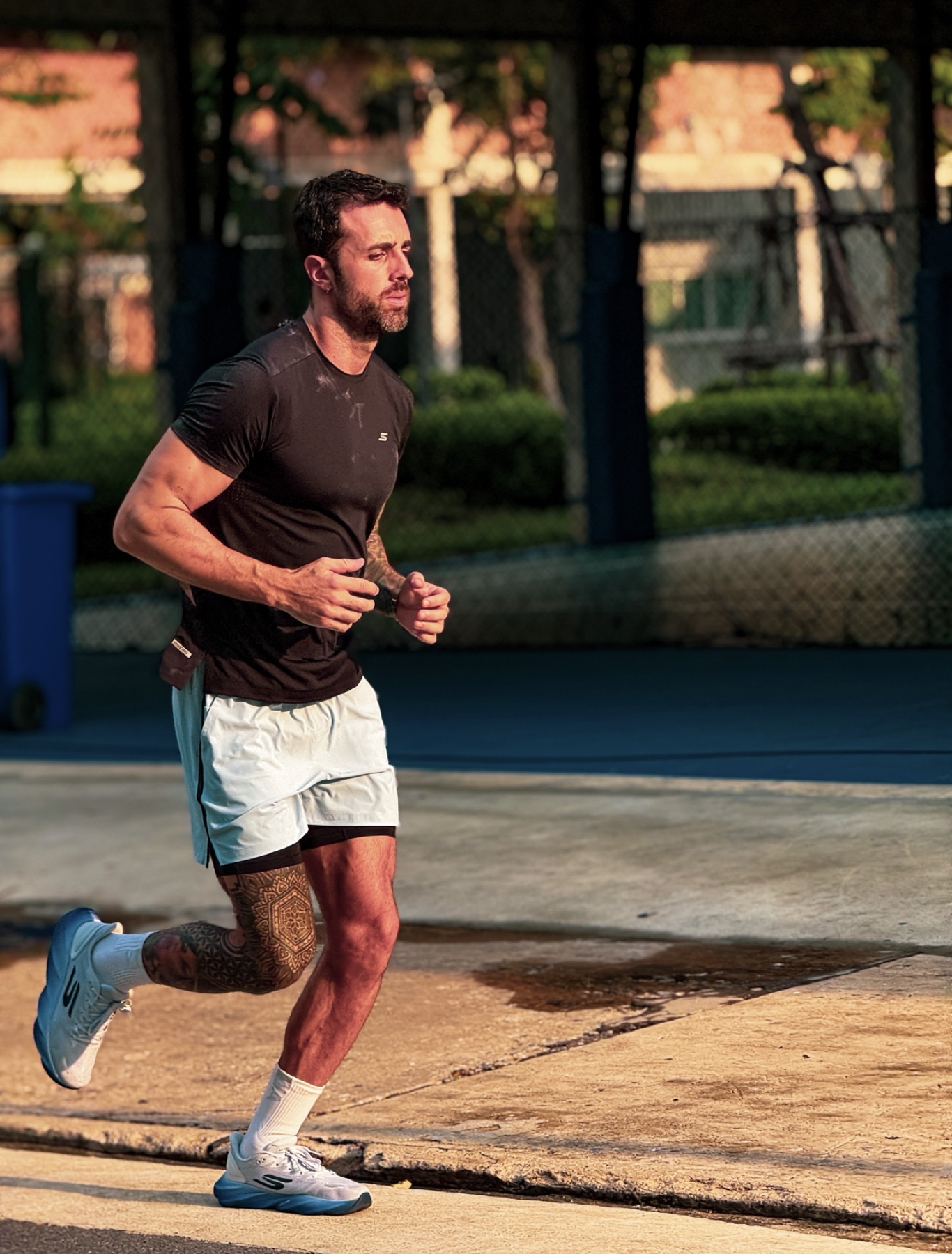 Luc running outdoors in the evening